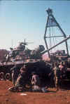 RVN D88 Devils Mistress maint guys working on 1st Platoon tank torsion bar Jan 1970.jpg (823819 bytes)
